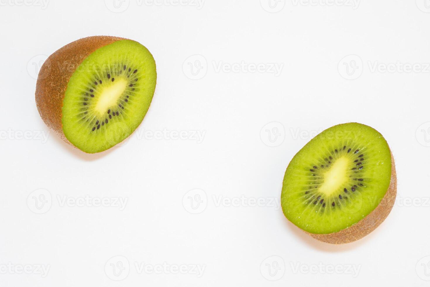 Close up from a kiwi cut in half on a white background. photo