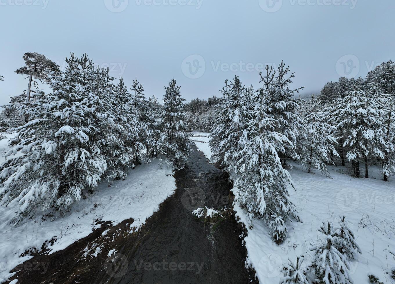 Amazing Cinematic Aerial View On Freezing River. Aerial View Flight Above Frozen Creek Scenic View Of Nature photo
