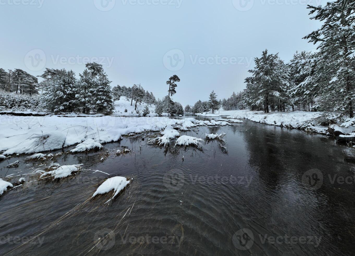 Amazing Cinematic Aerial View On Freezing River. Aerial View Flight Above Frozen Creek Scenic View Of Nature photo