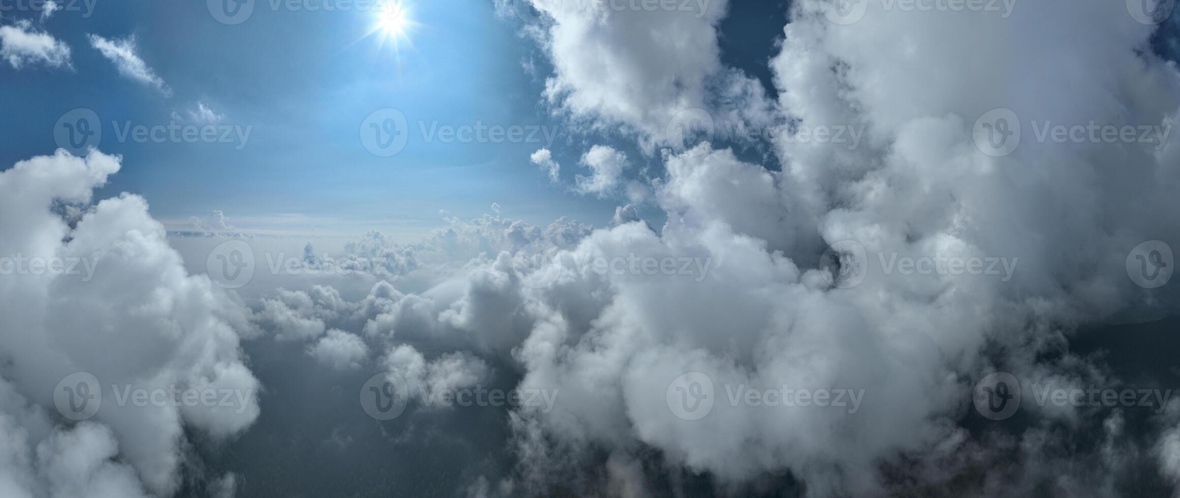 Drone flight above clouds during a misty sunrise morning photo