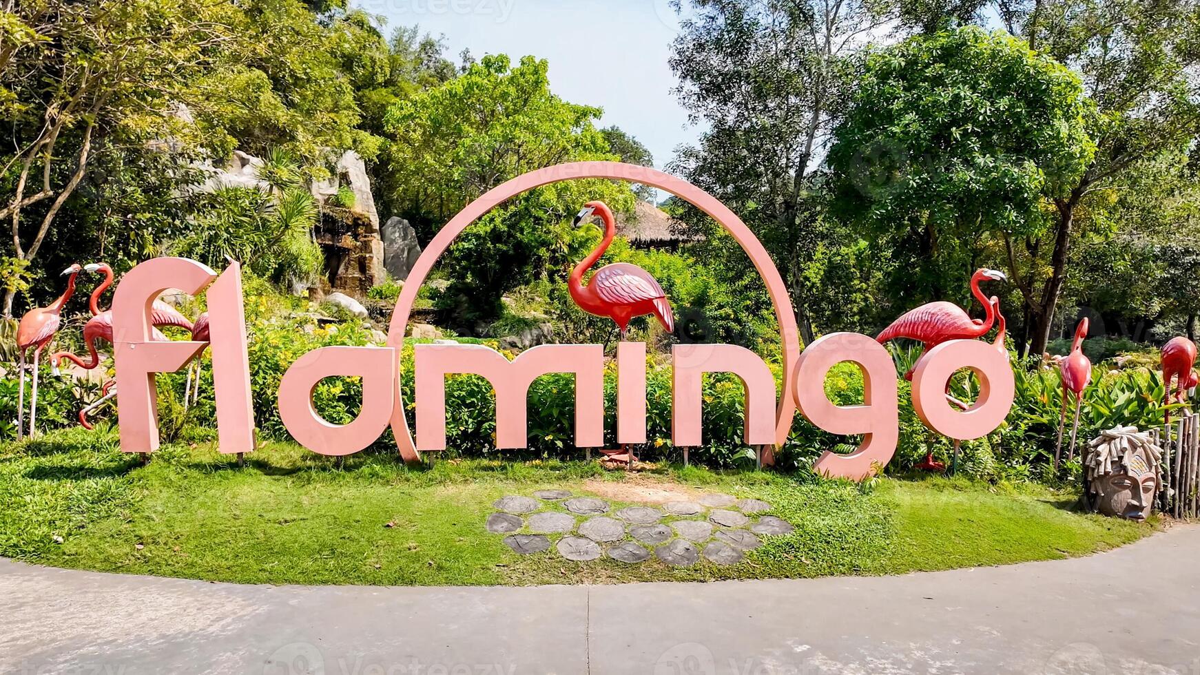 Vibrant flamingo themed garden display with oversized letters and tropical birds, perfect for World Flamingo Day and nature park visits 15 feb 2024, Vietnam, Pho quoc photo