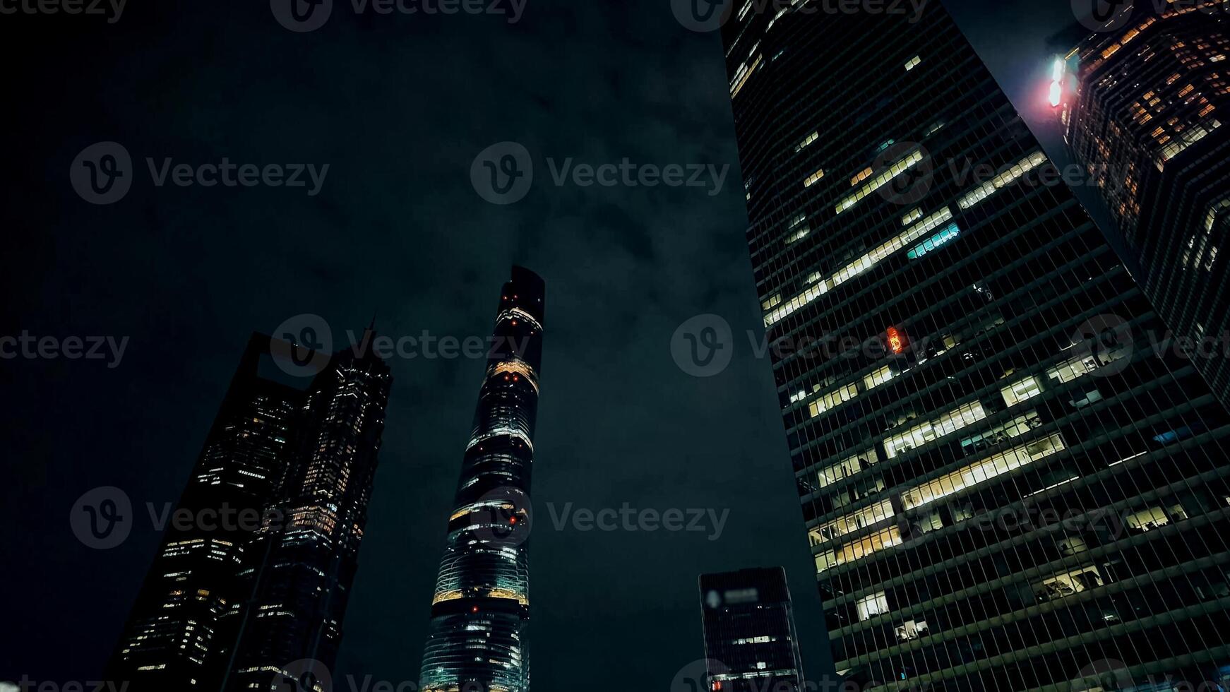 Dramatic night skyline with illuminated skyscrapers against a dark sky, conveying concepts of urbanization and modern architecture, suitable for business and travel 15 dec 2023, Shanghai, China photo