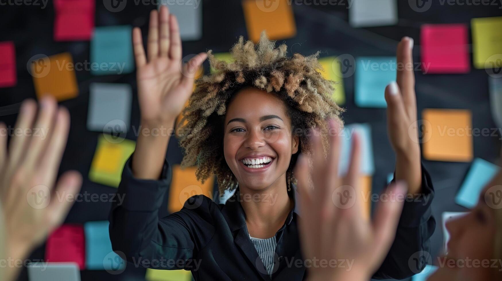 Successful Team Leader Celebrating with High Fives with Colleagues in Office Setting photo