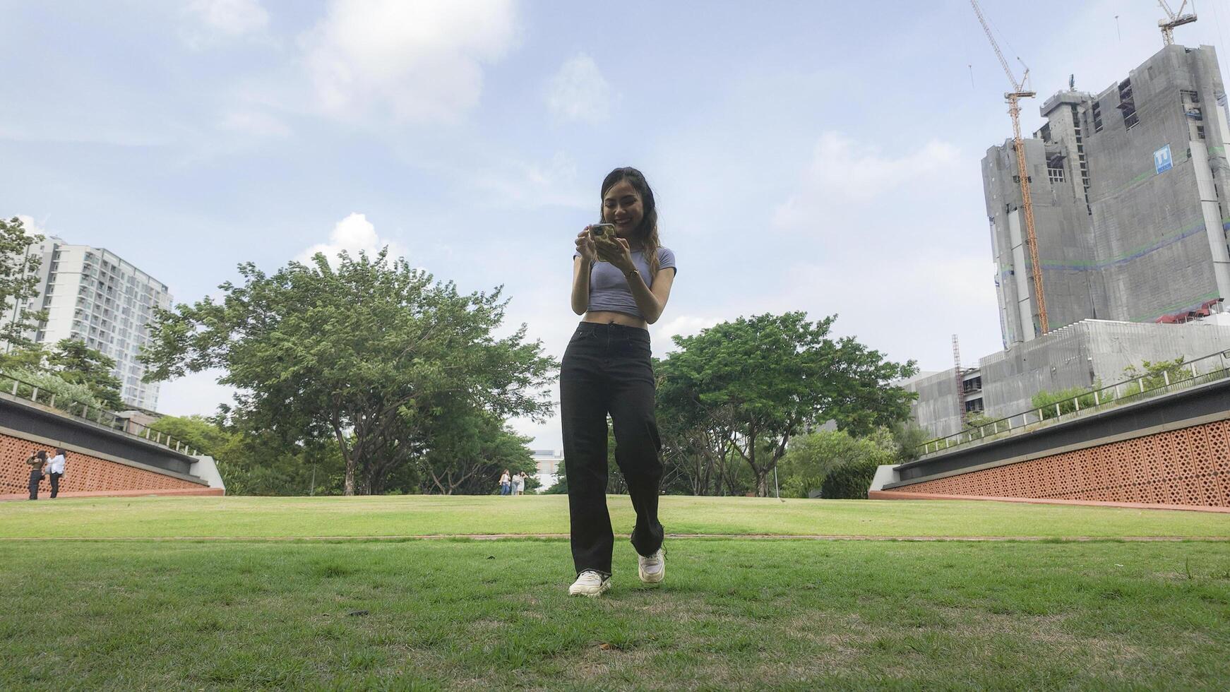Asian women do freestyle hip hop and breakdancing in a public space in the middle of the city. With a cheerful and happy attitude photo