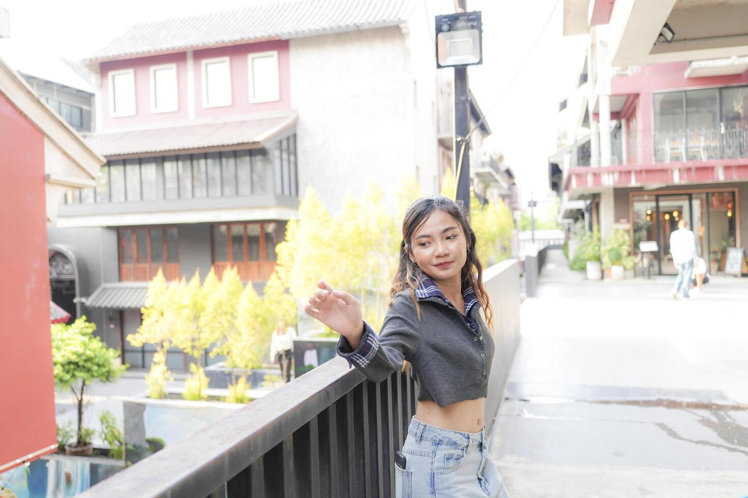 Asian women do freestyle hip hop and breakdancing in a public space in the middle of the city. With a cheerful and happy attitude photo