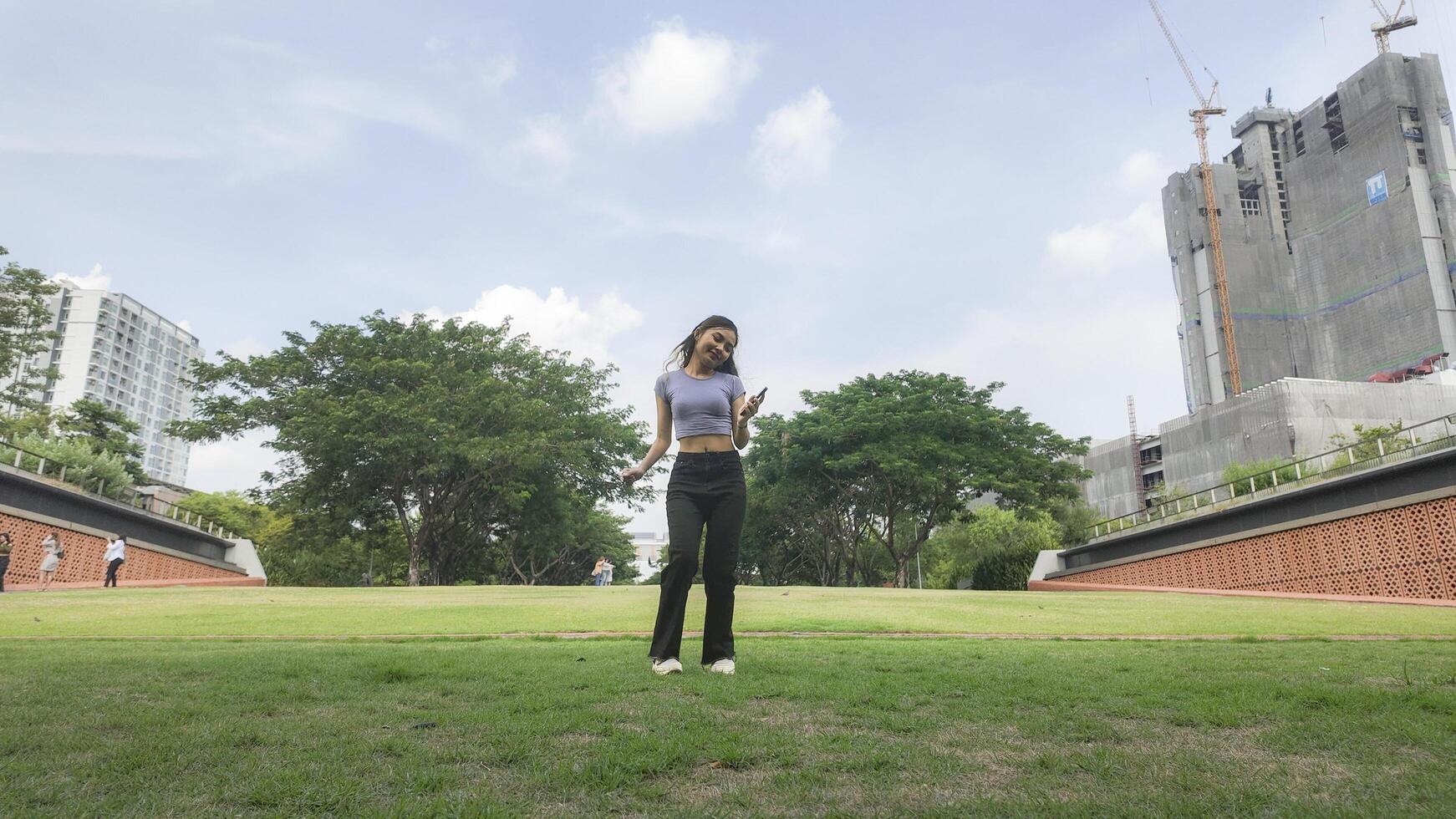 Asian women do freestyle hip hop and breakdancing in a public space in the middle of the city. With a cheerful and happy attitude photo
