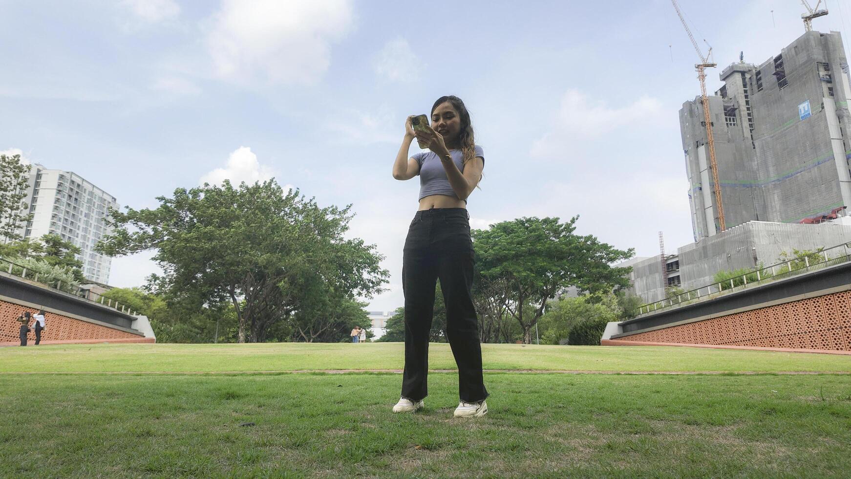 Asian women do freestyle hip hop and breakdancing in a public space in the middle of the city. With a cheerful and happy attitude photo