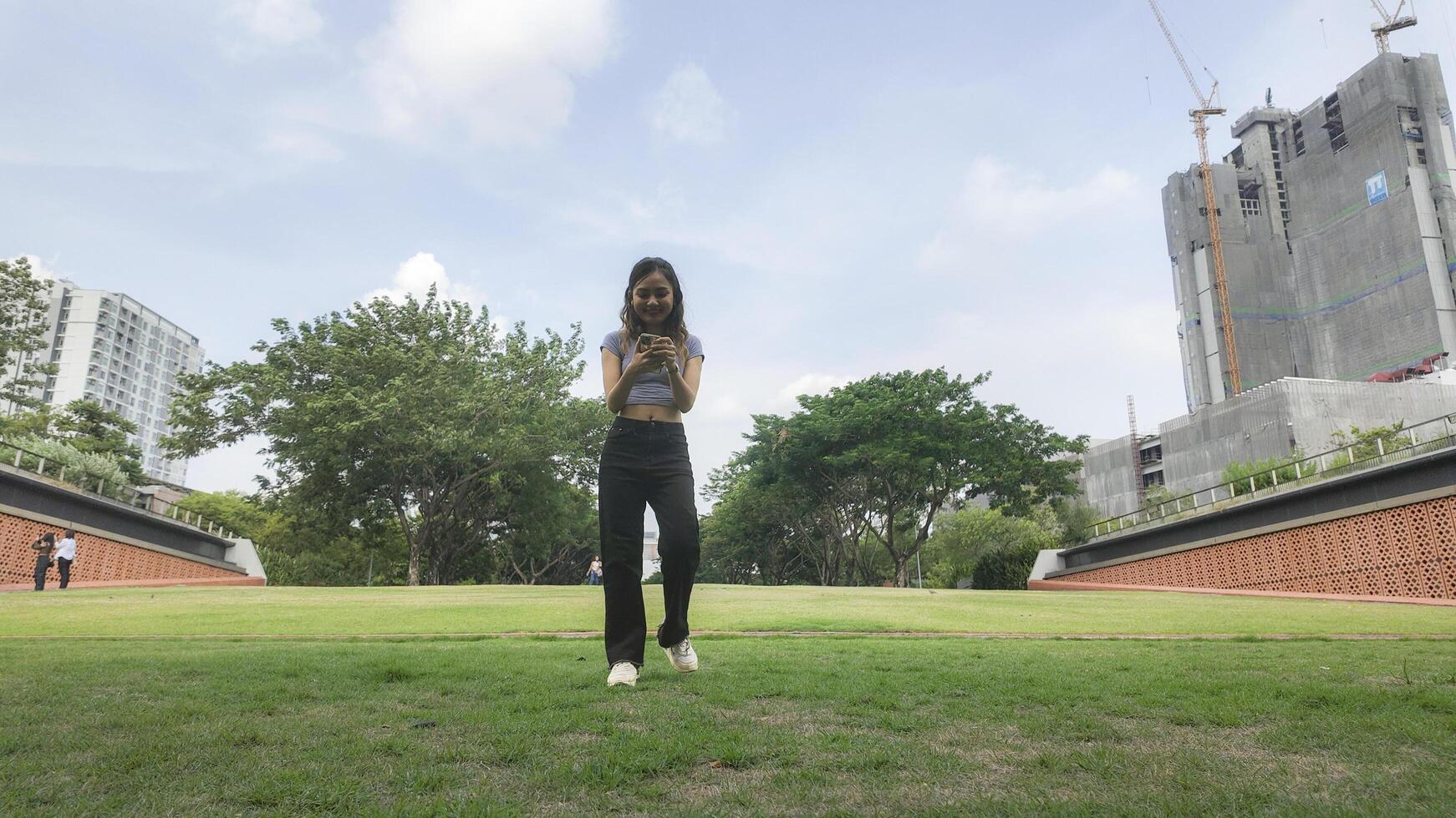 Asian women do freestyle hip hop and breakdancing in a public space in the middle of the city. With a cheerful and happy attitude photo