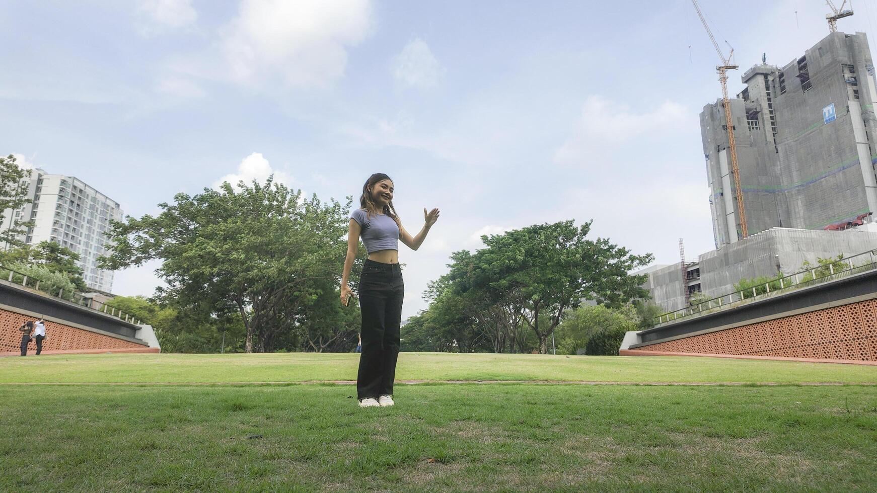 Asian women do freestyle hip hop and breakdancing in a public space in the middle of the city. With a cheerful and happy attitude photo