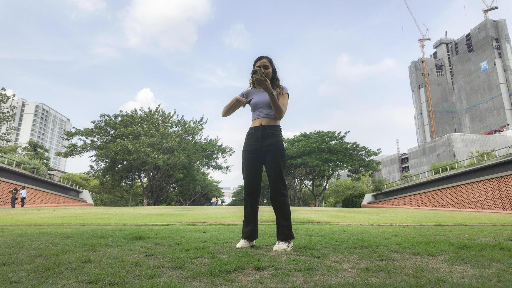 Asian women do freestyle hip hop and breakdancing in a public space in the middle of the city. With a cheerful and happy attitude photo