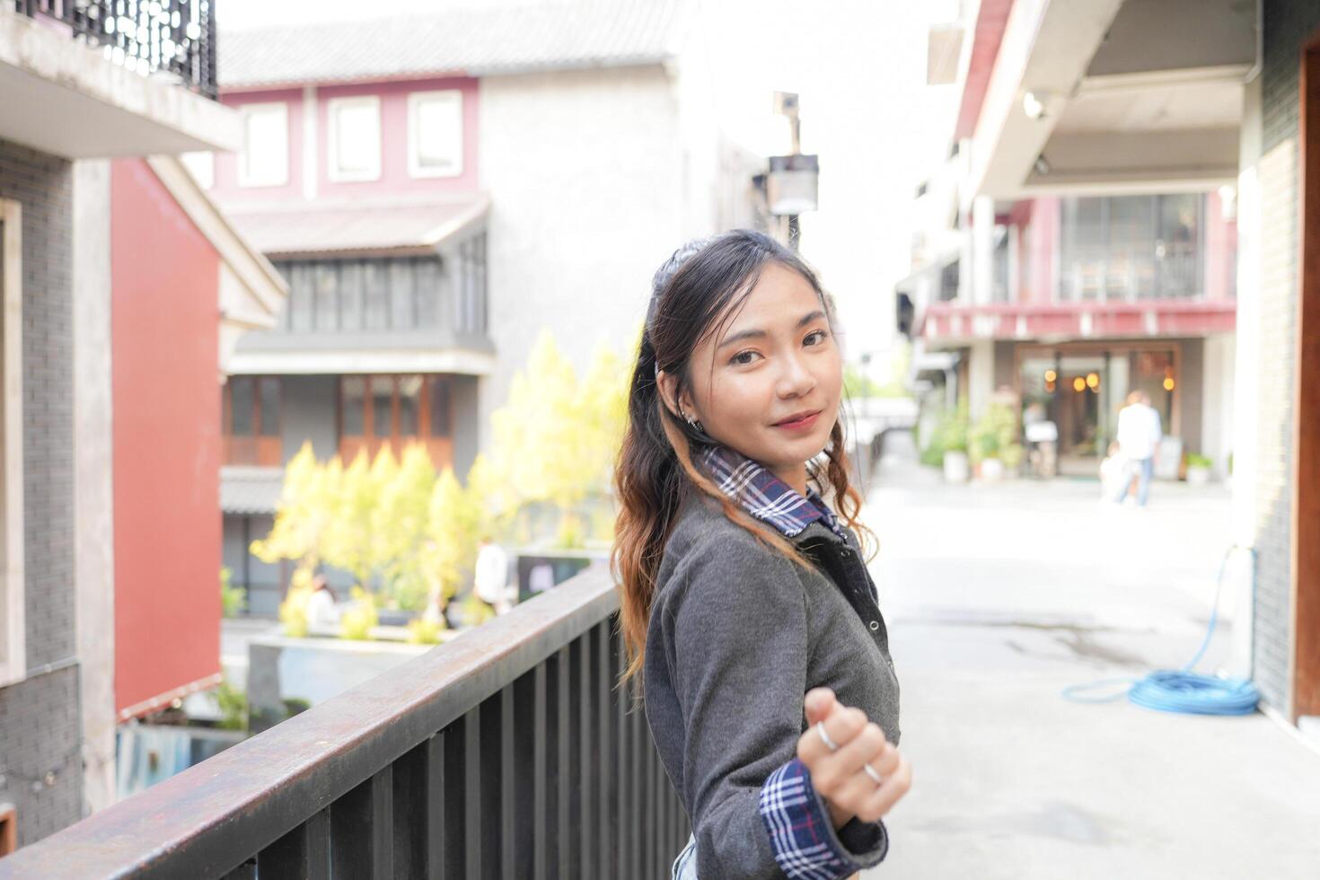 Asian women do freestyle hip hop and breakdancing in a public space in the middle of the city. With a cheerful and happy attitude photo