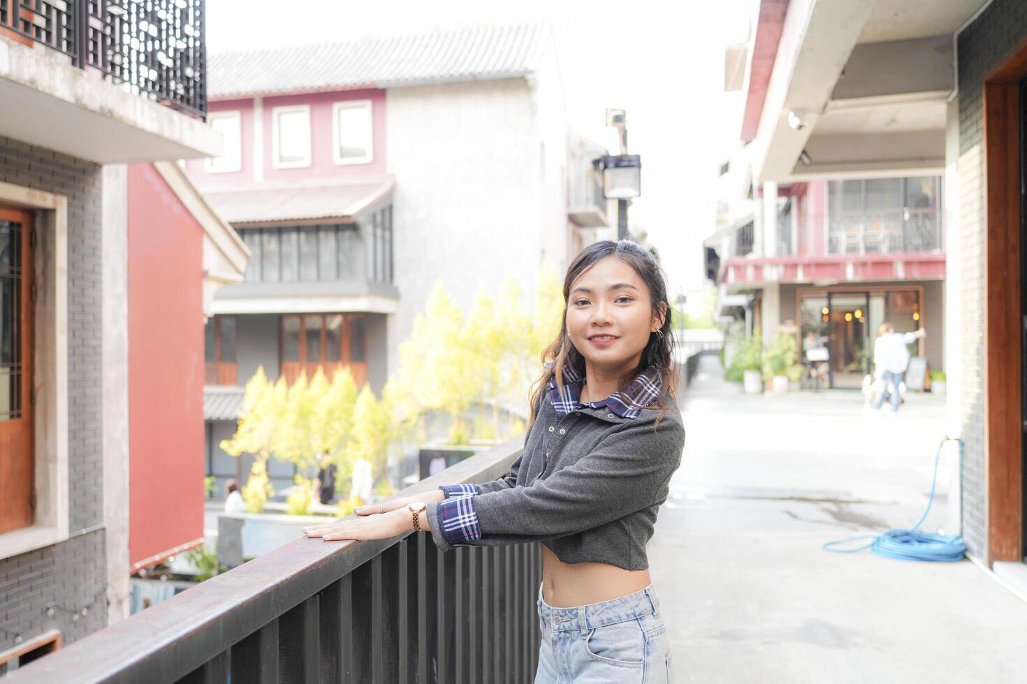 Asian women do freestyle hip hop and breakdancing in a public space in the middle of the city. With a cheerful and happy attitude photo