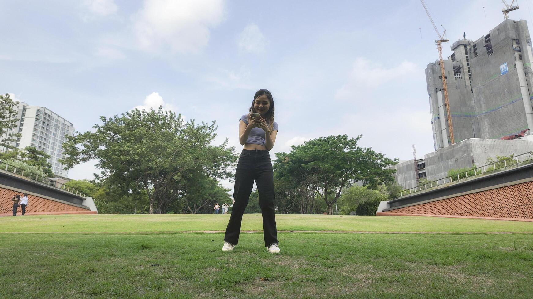 Asian women do freestyle hip hop and breakdancing in a public space in the middle of the city. With a cheerful and happy attitude photo
