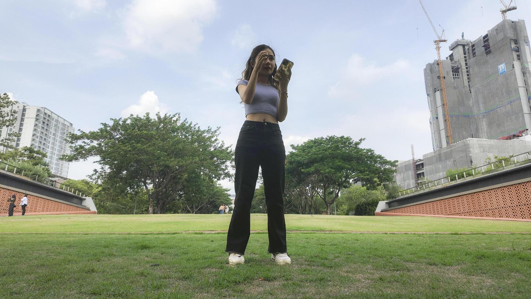 Asian women do freestyle hip hop and breakdancing in a public space in the middle of the city. With a cheerful and happy attitude photo