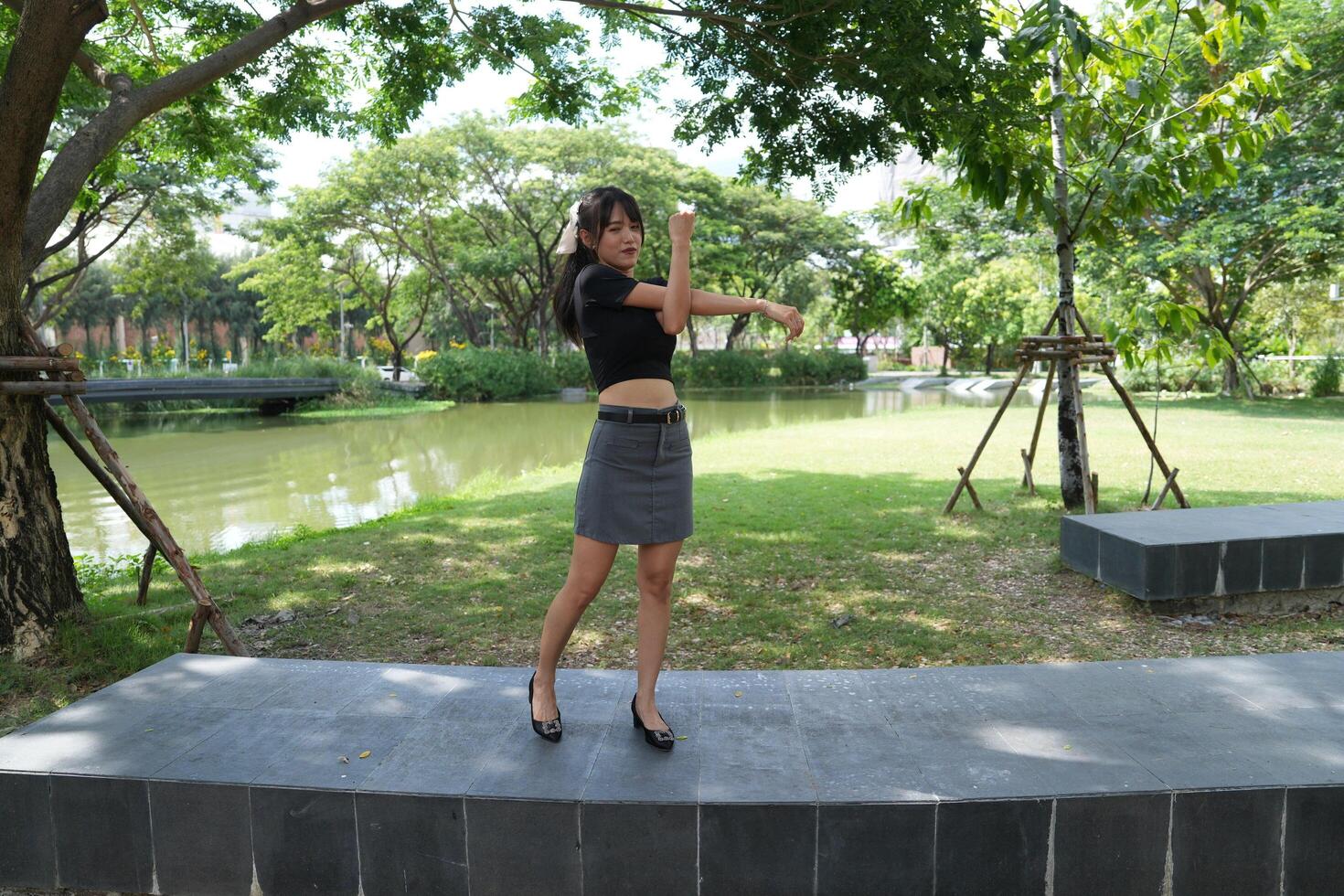 Asian women do freestyle hip hop and breakdancing in a public space in the middle of the city. With a cheerful and happy attitude photo