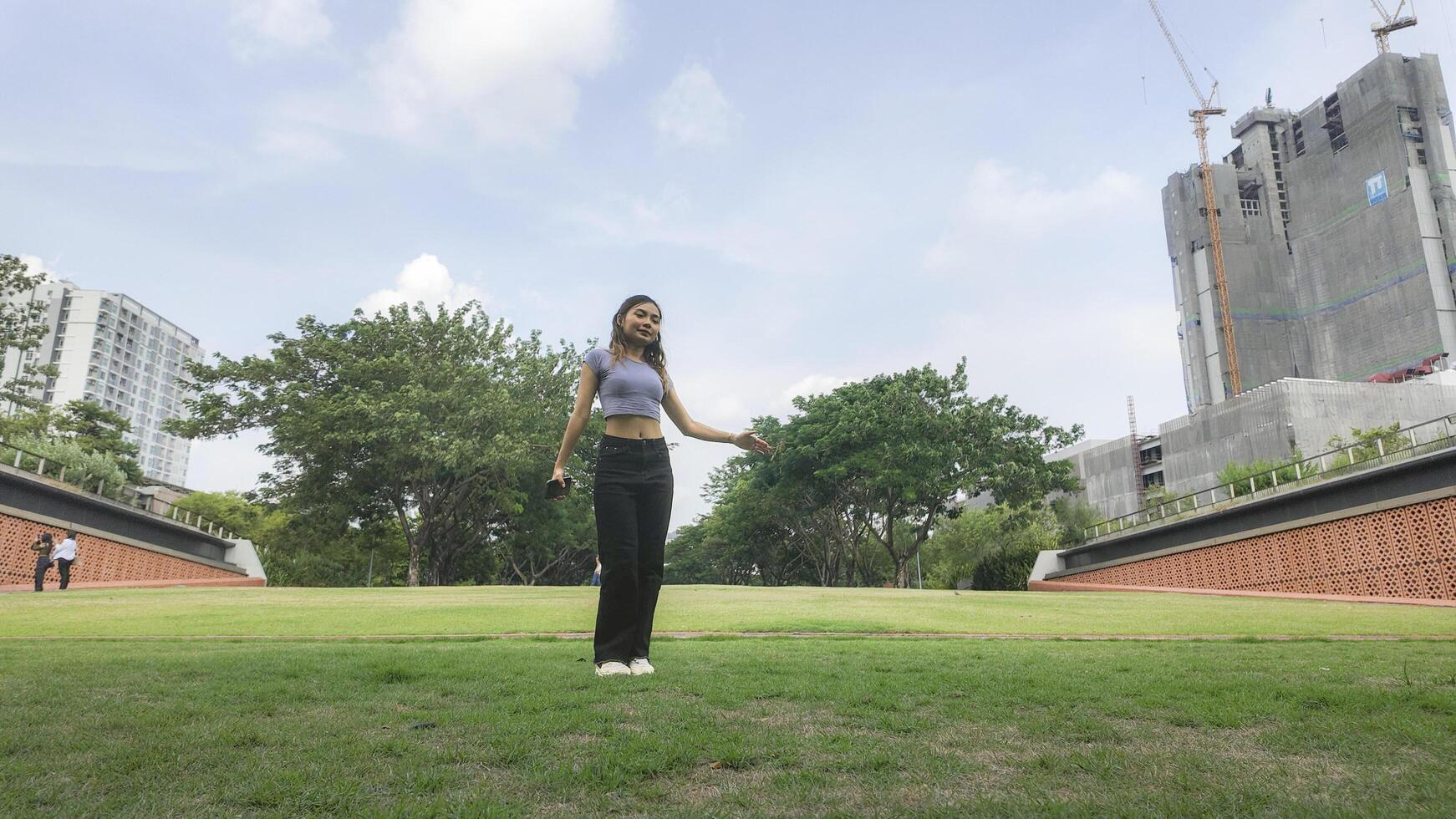 Asian women do freestyle hip hop and breakdancing in a public space in the middle of the city. With a cheerful and happy attitude photo