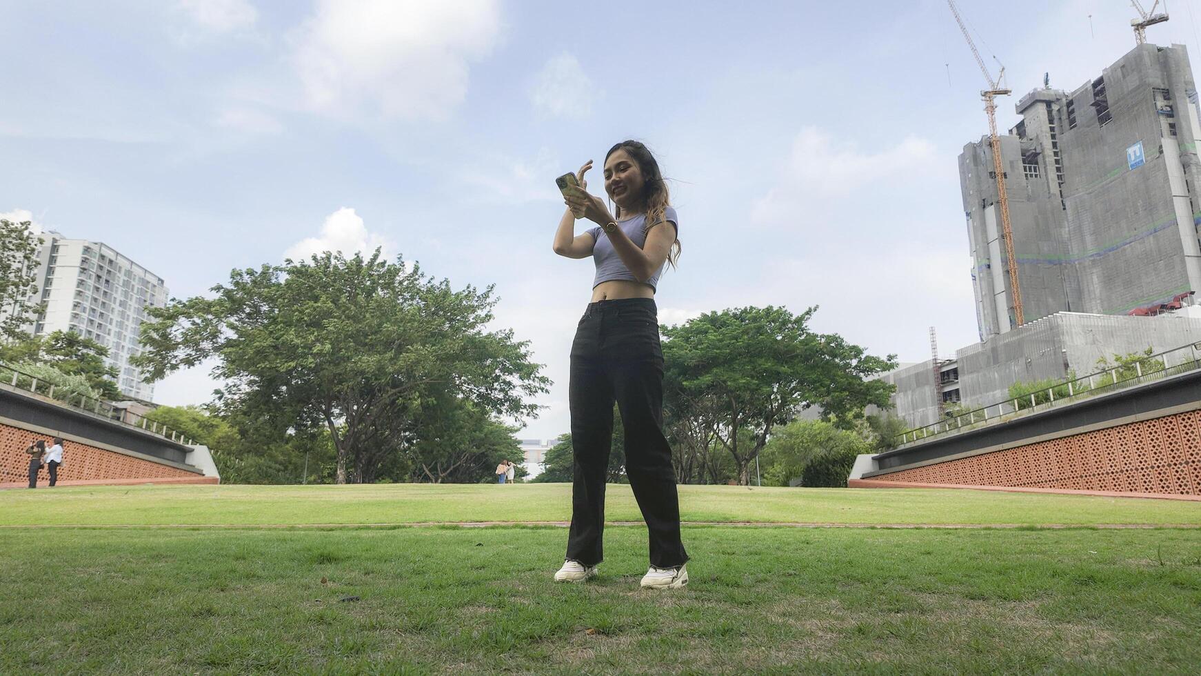 Asian women do freestyle hip hop and breakdancing in a public space in the middle of the city. With a cheerful and happy attitude photo