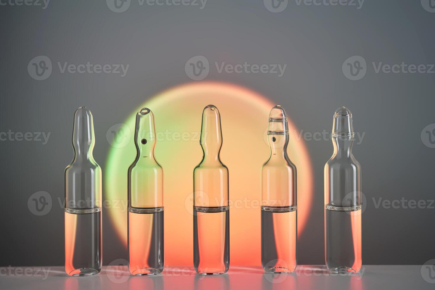 Ampoules for injection against the background of a bright orange circle. photo