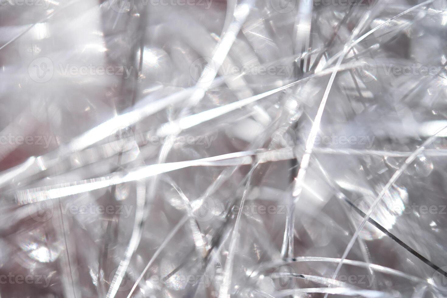 Light grey and white tinsel background with bokeh for Christmas. photo