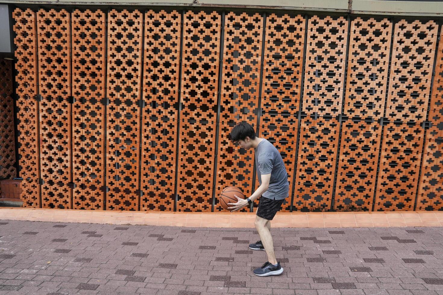 Men take a walk to relax after playing basketball in a public area, having fun and practicing at the same time. photo