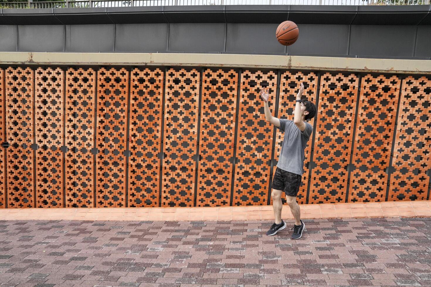 Men take a walk to relax after playing basketball in a public area, having fun and practicing at the same time. photo