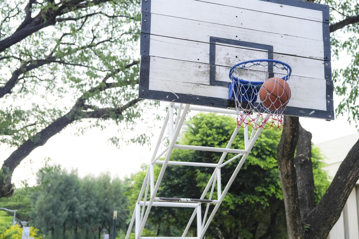 Men take a walk to relax after playing basketball in a public area, having fun and practicing at the same time. photo