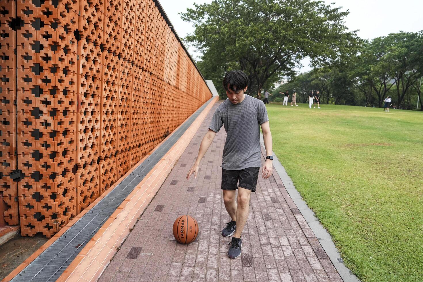 Men take a walk to relax after playing basketball in a public area, having fun and practicing at the same time. photo