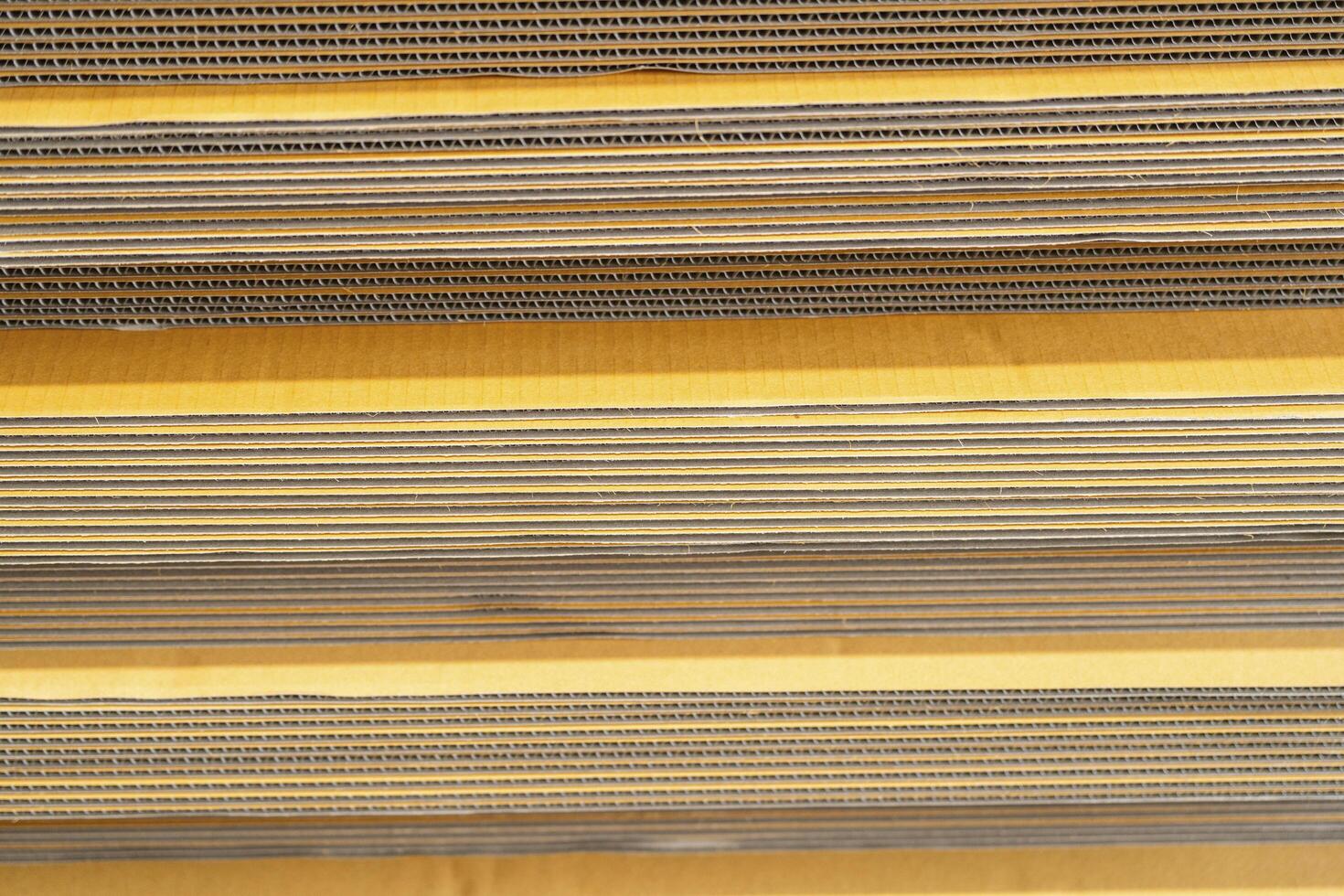 Cardboard, texture, background for graphics It is factory made cardboard waiting to be packed. photo