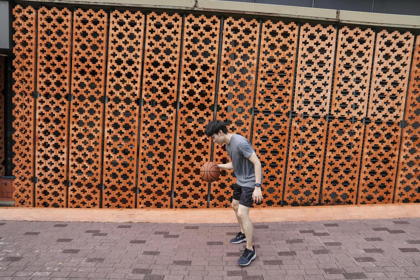 Men take a walk to relax after playing basketball in a public area, having fun and practicing at the same time. photo