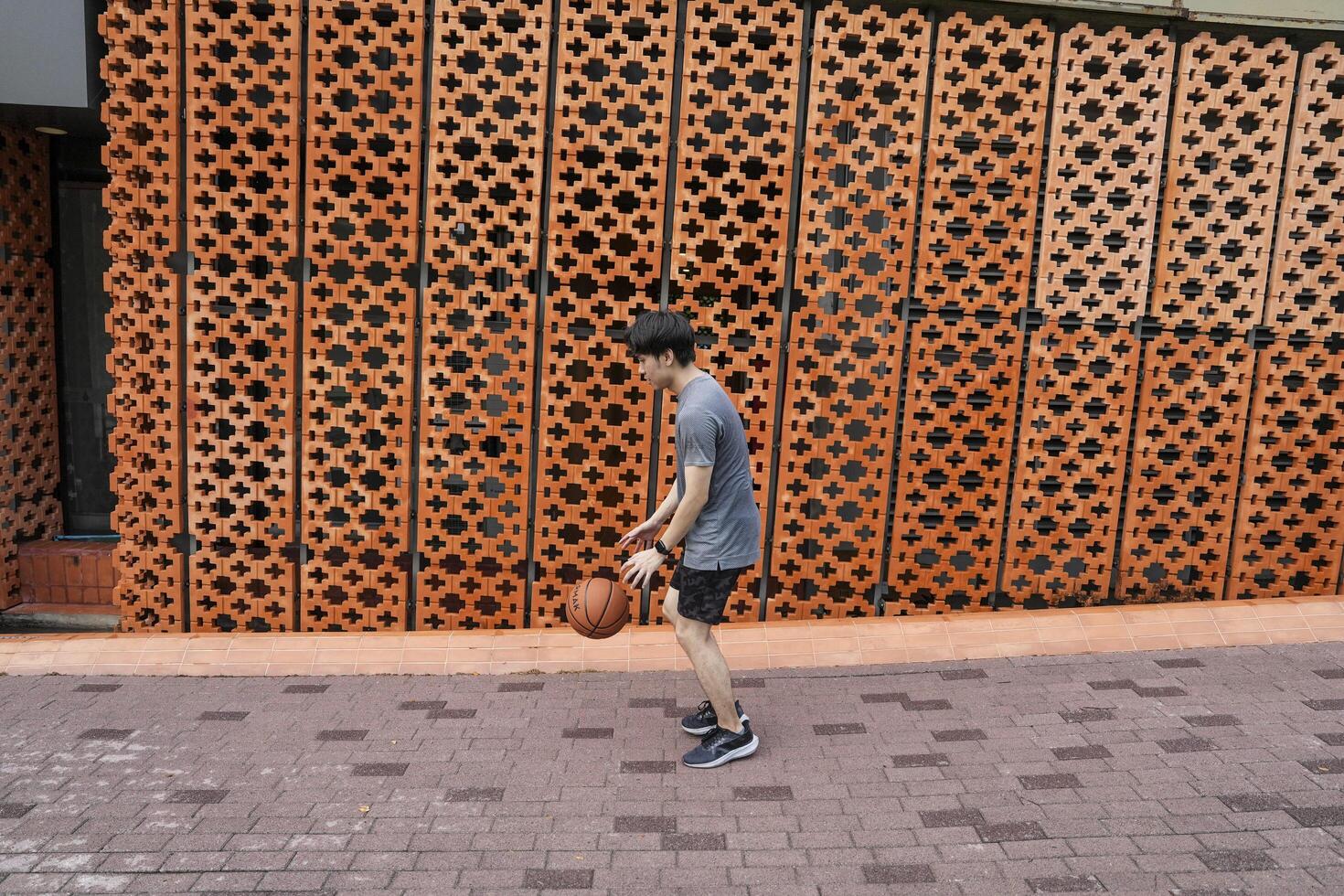 Men take a walk to relax after playing basketball in a public area, having fun and practicing at the same time. photo