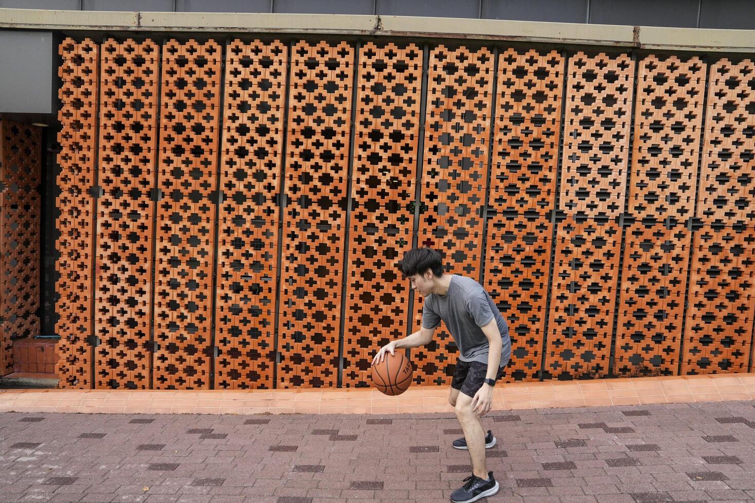 Men take a walk to relax after playing basketball in a public area, having fun and practicing at the same time. photo