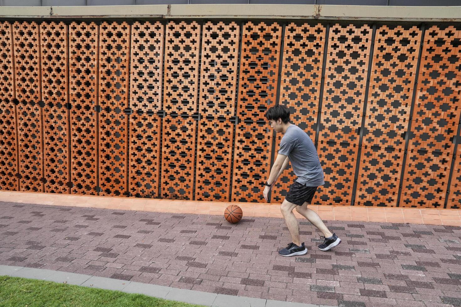 Men take a walk to relax after playing basketball in a public area, having fun and practicing at the same time. photo