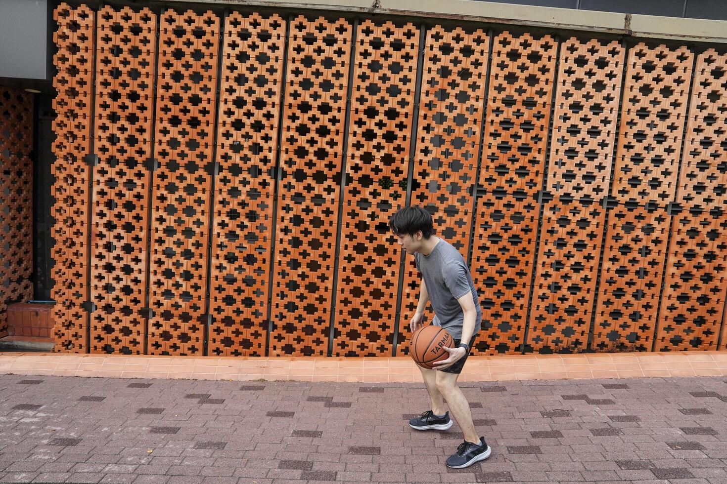 Men take a walk to relax after playing basketball in a public area, having fun and practicing at the same time. photo