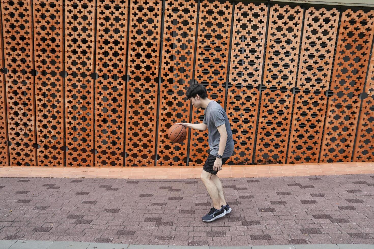 Men take a walk to relax after playing basketball in a public area, having fun and practicing at the same time. photo