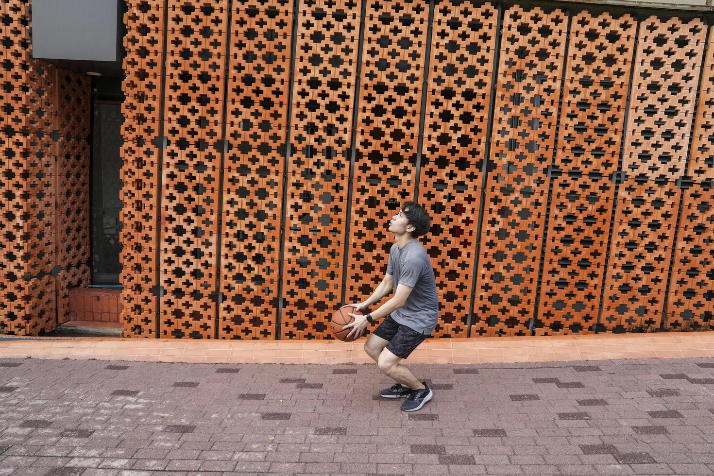 Men take a walk to relax after playing basketball in a public area, having fun and practicing at the same time. photo