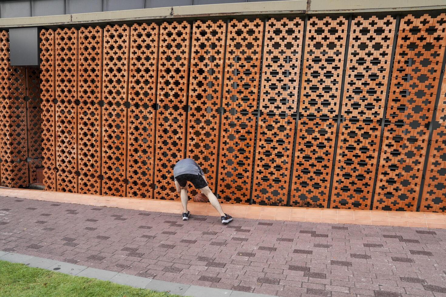 Men take a walk to relax after playing basketball in a public area, having fun and practicing at the same time. photo