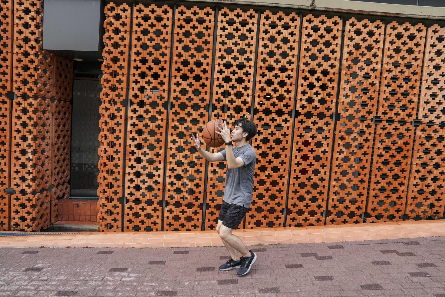 Men take a walk to relax after playing basketball in a public area, having fun and practicing at the same time. photo