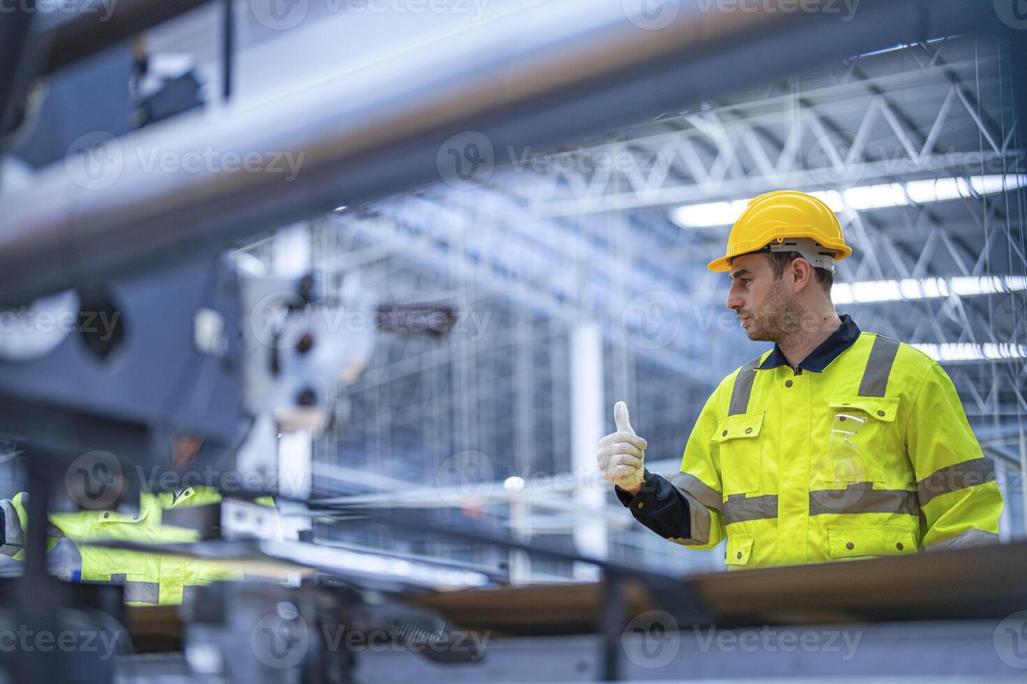 male and female technician engineers checking the process on Heavy machine. mechanical engineering team production. Industry manufacturing. Worker holding tablet and folde. High technology production. photo