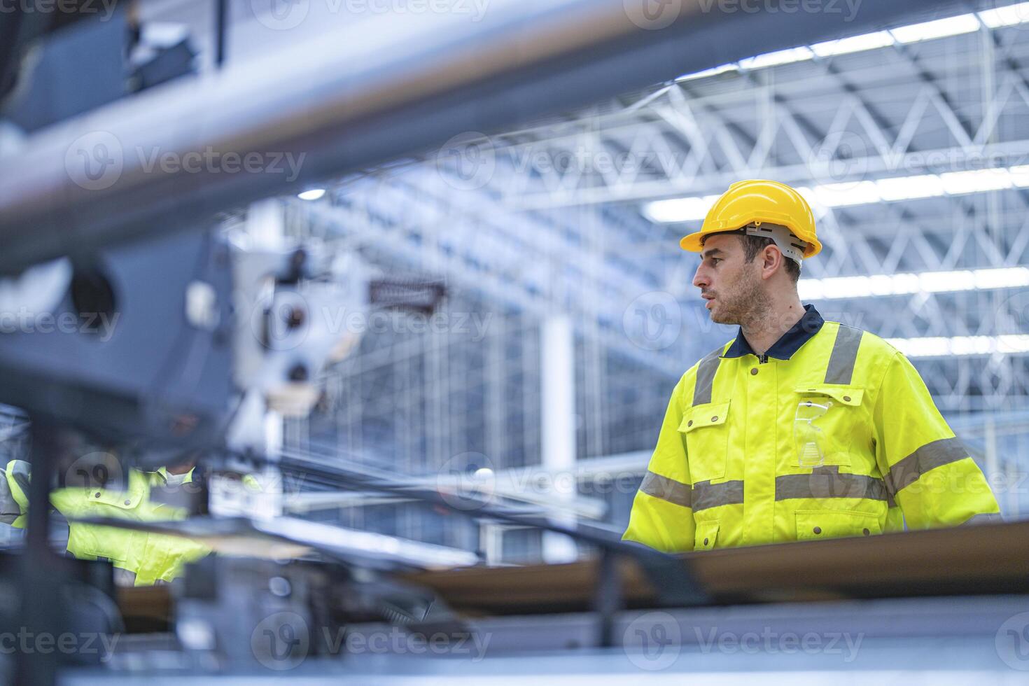 male and female technician engineers checking the process on Heavy machine. mechanical engineering team production. Industry manufacturing. Worker holding tablet and folde. High technology production. photo
