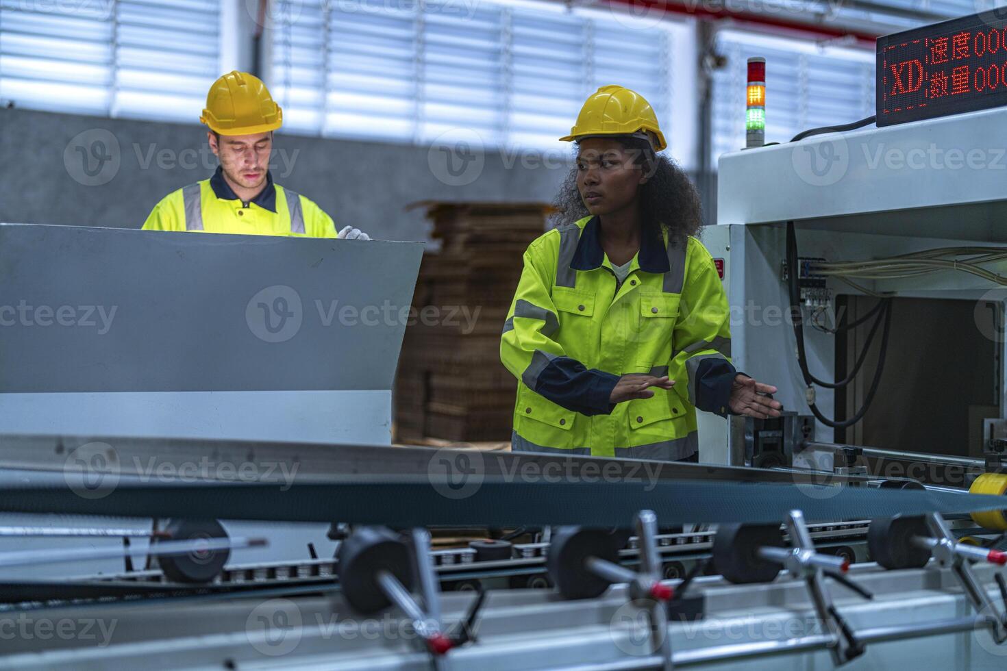 male and female technician engineers checking the process on Heavy machine. mechanical engineering team production. Industry manufacturing. Worker holding tablet and folde. High technology production. photo