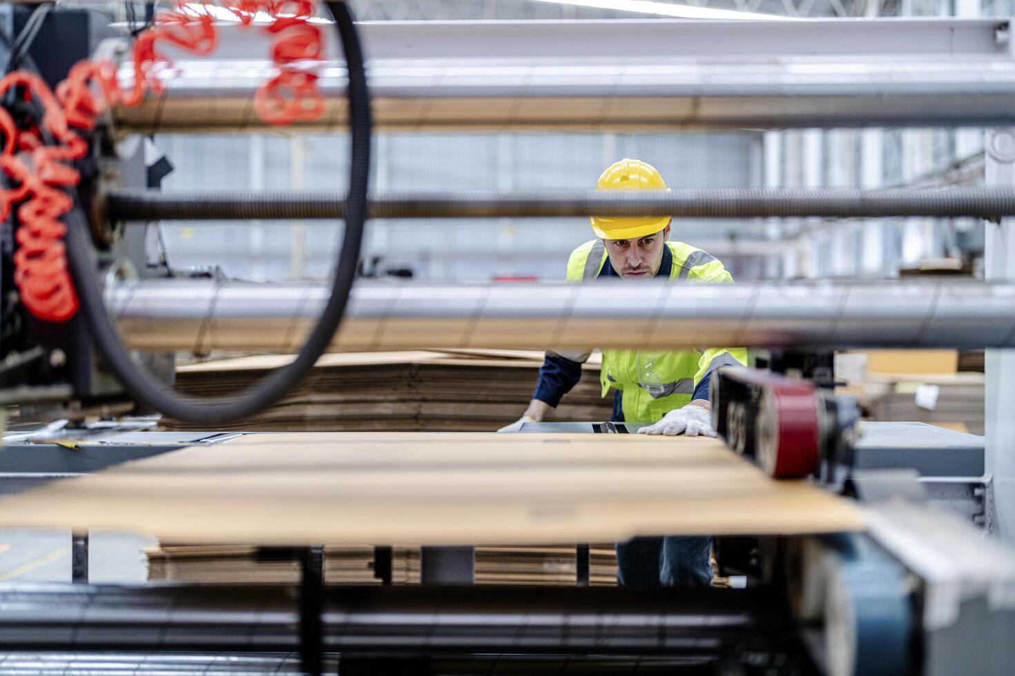 technician engineers checking the process on Heavy machine. mechanical engineering team production. Industry manufacturing. Worker holding tablet and folde. High technology production. photo