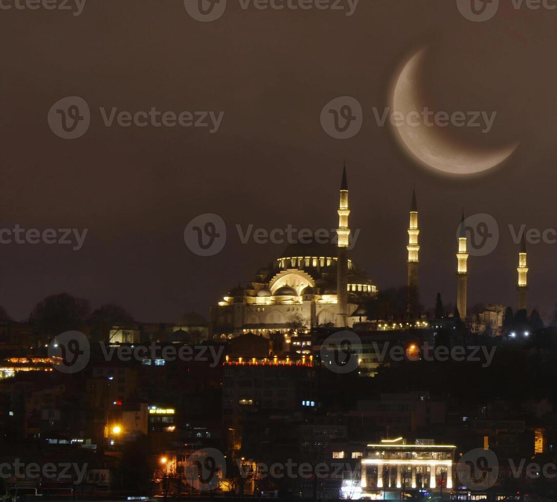 Suleymaniye mosque with a crescent moon in the background. Happy the 27th day of Ramadan or laylat al-qadr. photo
