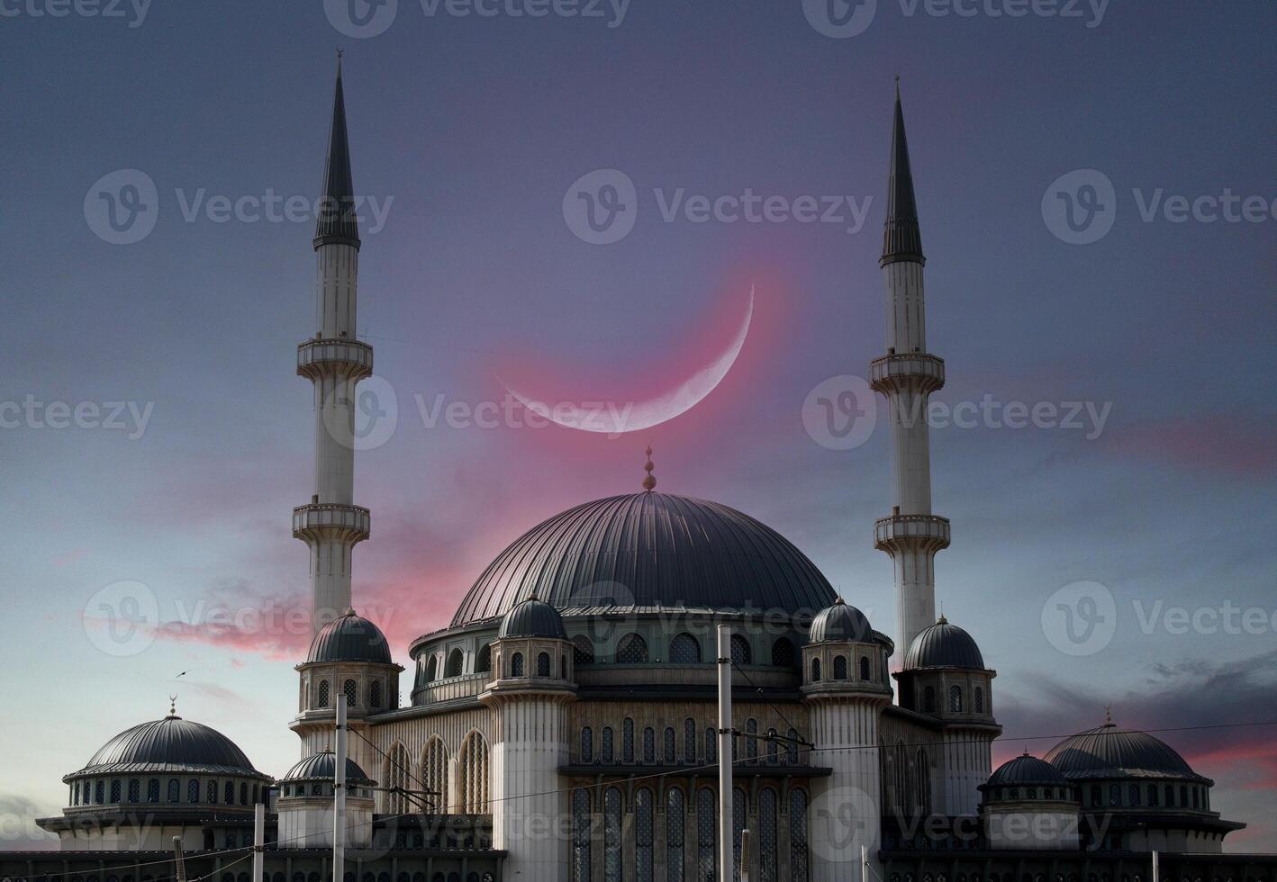 Taksim mosque with a crescent moon in the background. Happy the 27th day of Ramadan or laylat al-qadr. Istanbul, Turkey photo