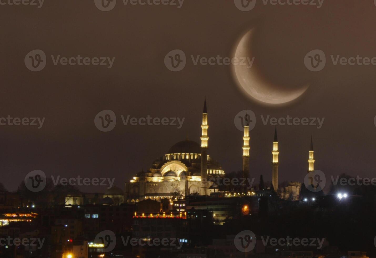 Suleymaniye mosque with a crescent moon in the background. Happy the 27th day of Ramadan or laylat al-qadr. photo