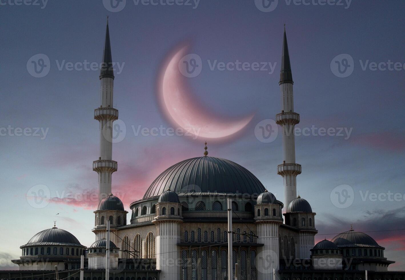 Taksim mosque with a crescent moon in the background. Happy the 27th day of Ramadan or laylat al-qadr. Istanbul, Turkey photo