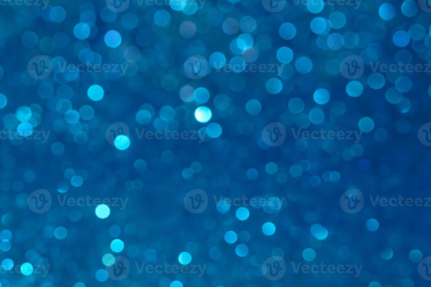 Blue Sparkling Lights with Festive Bokeh and Falling Stars - Winter Background photo