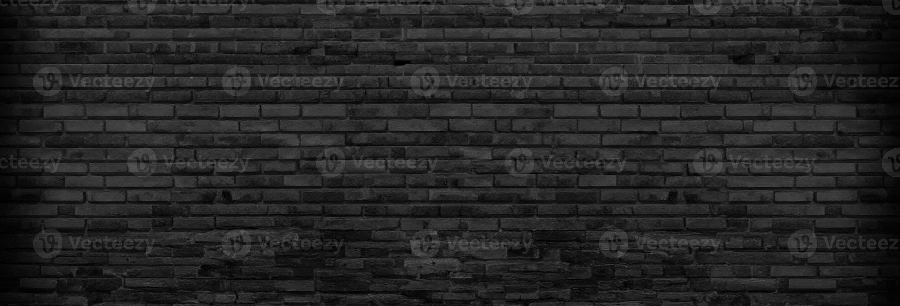 Textured Panoramic Background of Unplastered Black Brick Wall in Empty Basement photo