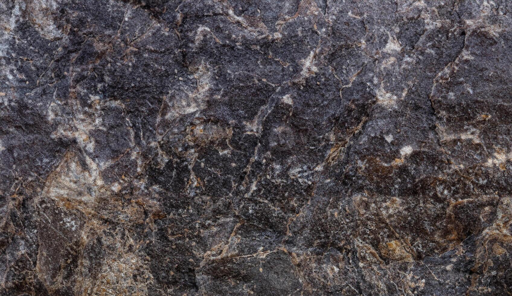 Macro Shot of Weathered Black Stone Texture in High Resolution photo