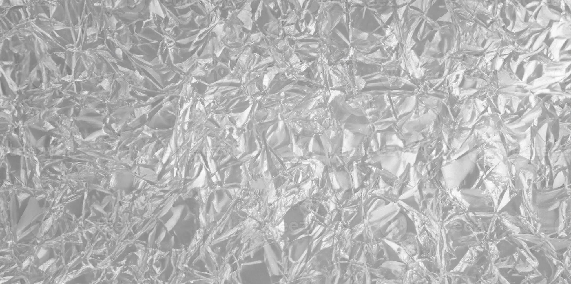 Silver Foil Texture Background with Smooth Metallic Surface and Light Reflections photo