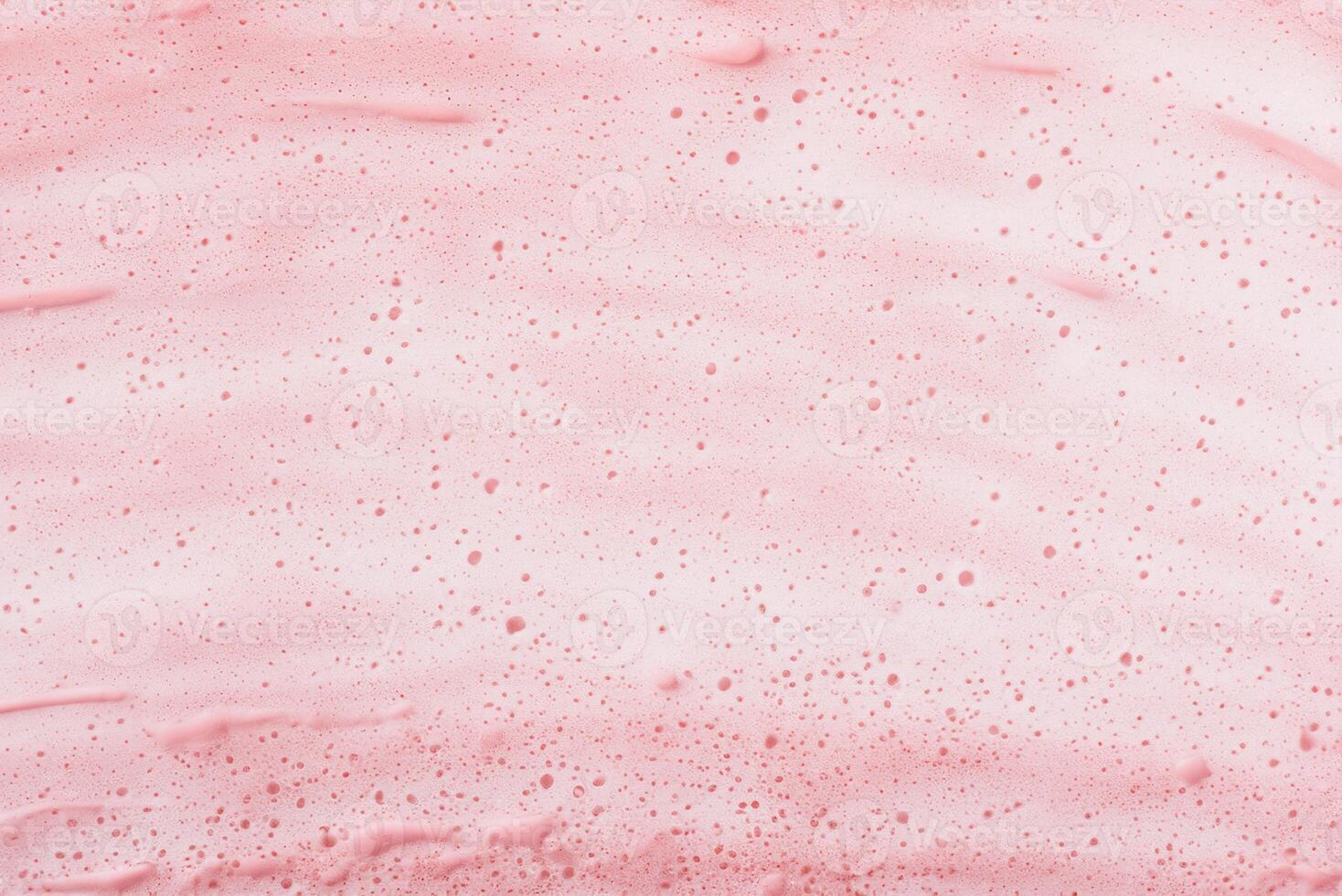Close-up of Cosmetic Foam Bubbles on Pink Background photo